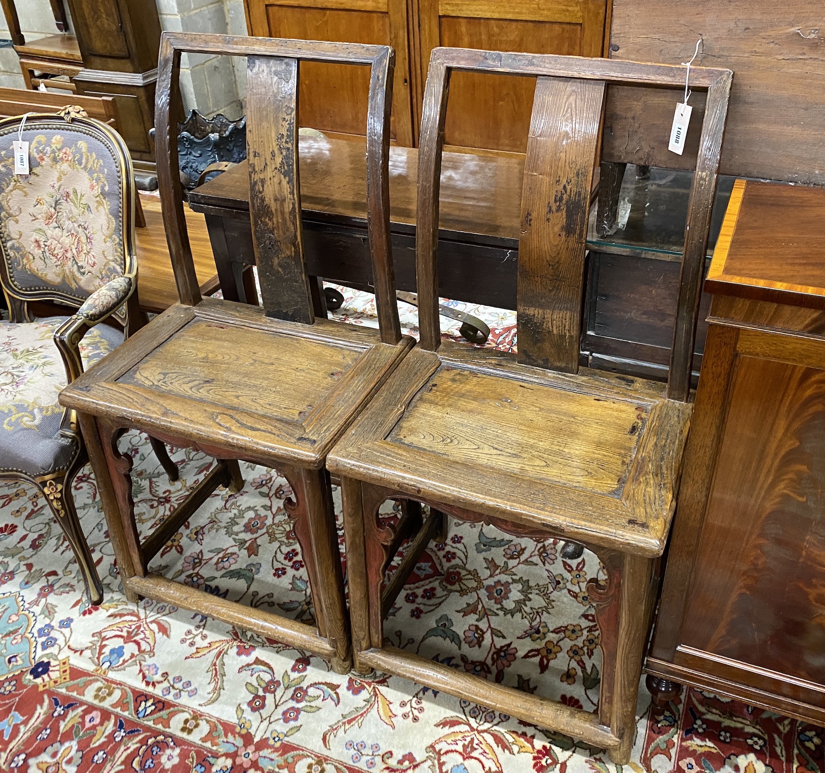 A pair of Chinese elm side chairs, width 54cm, depth 39cm, height 107cm